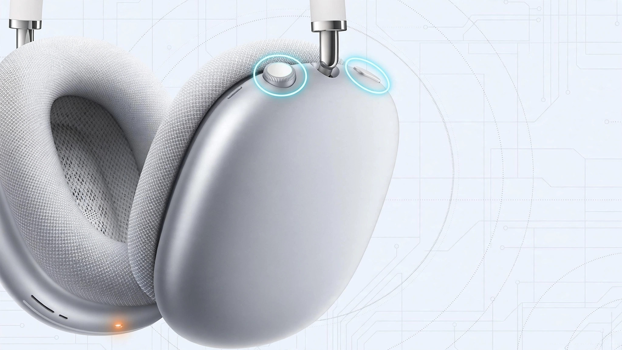AirPods Max upside down with a finger holding the Digital Crown and noise control buttons